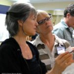 Sherrie gives pointers to a workshop participant.